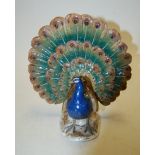 A circa 1900 Meissen porcelain peacock, crossed sword mark, further numbered 276,