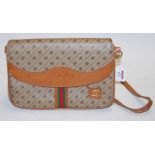 A ladies brown stitched leather and canvas handbag,