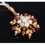 A 9ct gold opal ruby and seed pearl set snowflake pendant, 2.7g, dia. 2.