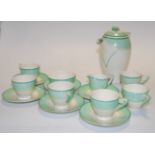 An early 20th century Wedgwood six-place setting tea service, on a cream ground with green banding,