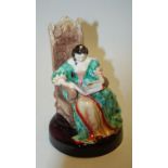 A Royal Doulton figure 'The Leisure Hour',