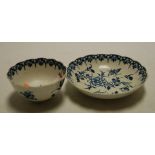An 18th century Worcester blue and white tea bowl and saucer,