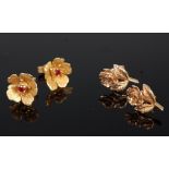 A pair of 18ct gold and ruby set flowerhead ear studs, 3.7g, dia.