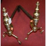A pair of early 20th century turned brass and wrought iron andirons