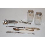 Assorted silver wares to include button hook, sugar bows, dressing table bottles,