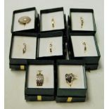 A collection of eight hardstone semi-precious set ladies dress rings,