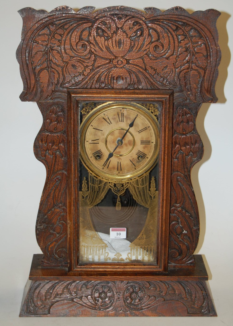 A late 19th century oak cased mantel clock by the Ansonia clock Company,