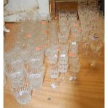 A large collection of cut glassware to include a set of 6 Waterford champagne flutes etc