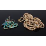 An Egyptian multi string necklace of tomb beads together with one other Egyptian beaded necklace to