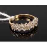 An 18ct gold diamond half eternity ring, arranged as fourteen pairs of small brilliants,