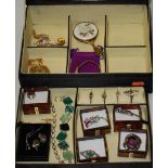 An embroidered jewellery box and contents, to include mainly silver gem set rings,