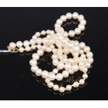 A graduated cultured and knotted pearl necklace (now as two separate joined necklaces) length 84cm