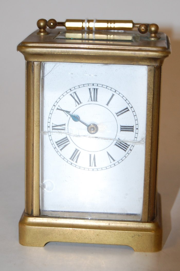 An early 20th century lacquered brass cased carriage clock,