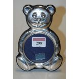 A modern silver mounted easel photograph frame as a teddybear