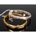 A rolled gold hinge bangle,