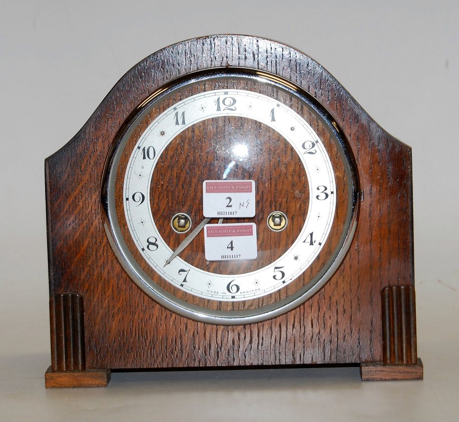 A 1930s oak cased mantel clock,