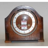 A 1930s oak cased mantel clock,