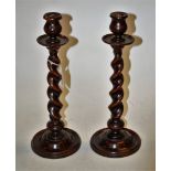 A pair of early 20th century beech barleytwist table candlesticks, h.