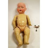 A large early 20th century Ernst Heubach bisque head doll, lacking hair,