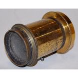 An early 20th century lacquered brass lens,