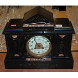 An Edwardian black slate and rouge marble cased mantel clock of architectural form having enamel