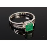 A contemporary 14ct white gold, emerald and diamond dress ring,