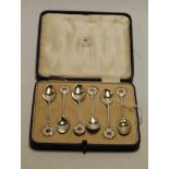A cased set of six Mappin & Webb silver coffee spoons, with Yorkshire Rose enamel set terminals,