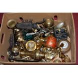 A box of miscellaneous metal ware to include cast iron boot jack, iron trivet,