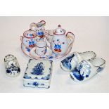 An early 20th century child's porcelain tea set on tray together with various Dutch Delft clogs,