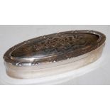 A circa 1900 silver table snuff-box, of oval form,