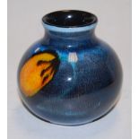 A small Poole pottery vase, of squat circular form,