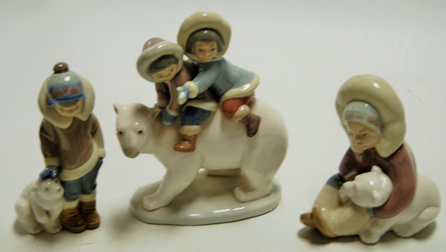 A Lladro figure of children on the back of a polar bear, printed mark verso and impressed 5353, h.