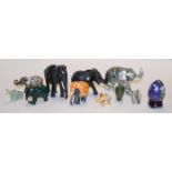 A small collection of assorted elephant figures to include carved ebonised examples;