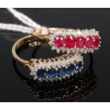 A pair of 9ct gold rings, one set with five oval cut sapphires, the other with five oval cut rubies,