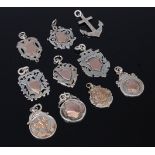 A quantity of silver pendant fob medals to include yellow metal mounted example,