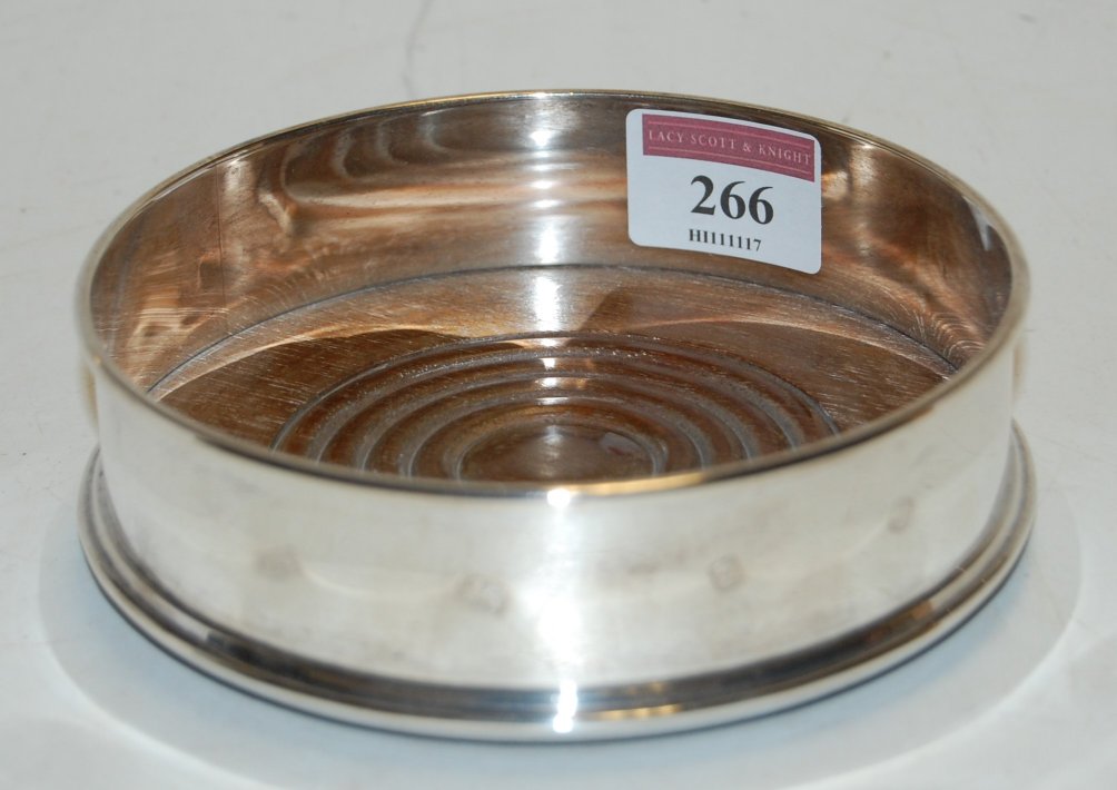 A modern silver wine coaster, maker W.E.V.