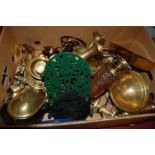 A box of miscellaneous metalwares to include iron trivets, Indian brass vases,