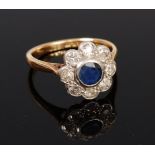 An 18ct gold and platinum, sapphire and diamond set flower head cluster ring,