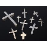 Assorted silver and white metal pendant crosses,