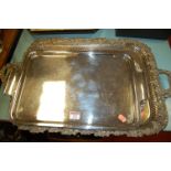 A large silver plated twin handled serving tray,