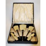 An Art Deco faux enamel and silver plated five-piece dressing table set,