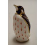 A Royal Crown Derby penguin desk ornament, with gold stopper,
