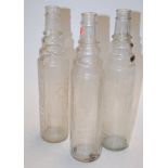 Three ESSO Lube glass oil bottles
