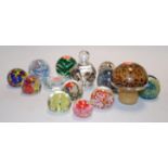 A collection of assorted glass paperweights,