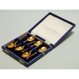 A cased set of six modern silver gilt and enamel set teaspoons, maker Turner & Simpson Ltd,