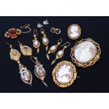Assorted costume jewellery to include carved shell cameo brooch in pinchbeck mount, two others,