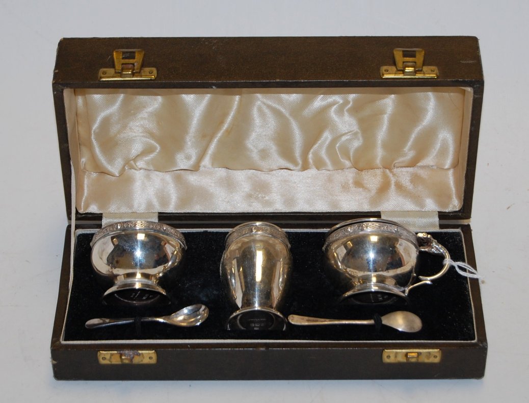 A mid 20th century cased silver three piece cruet set, maker Charles S Green & Co Ltd,