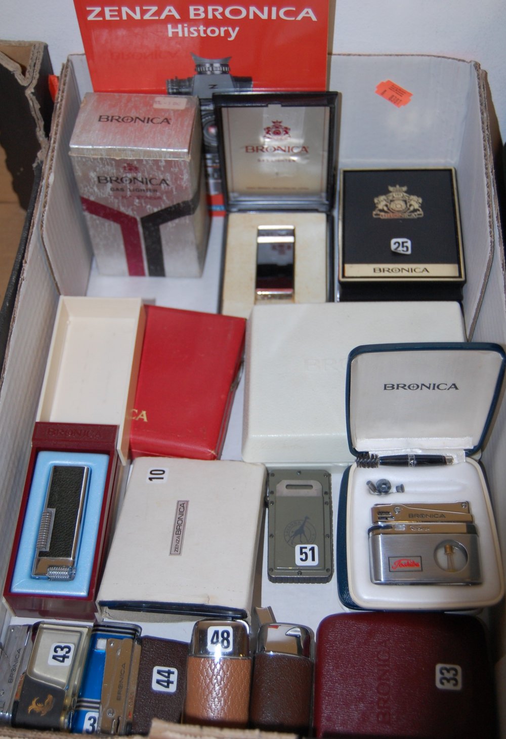 A large collection of Bronica pocket cigarette lighters,