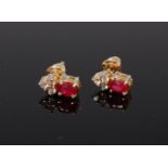A pair of 18ct gold ruby and diamond set ear studs,