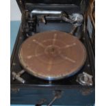 An early 20th century canvas clad portable wind-up gramophone